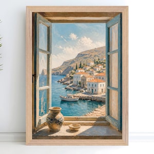 May include: A framed wall art print depicting an open window view of a coastal Mediterranean village with white buildings, orange roofs, and a small boat on blue water. A ceramic vase and a small bowl sit on the window sill in the foreground.