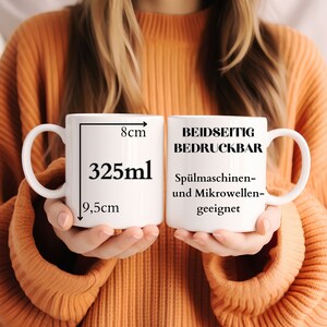 May include: Two white ceramic mugs with black text. The mug on the left has "325ml" printed on it with measurements of 8 inches in width and 9.5 inches in height. The mug on the right has "Beidseitig Bedruckbar" printed on it, which translates to "Double-sided Printable". The text also says "Sp&uuml;lmaschinen- und Mikrowellen-geeignet", which translates to "Dishwasher and Microwave Safe".