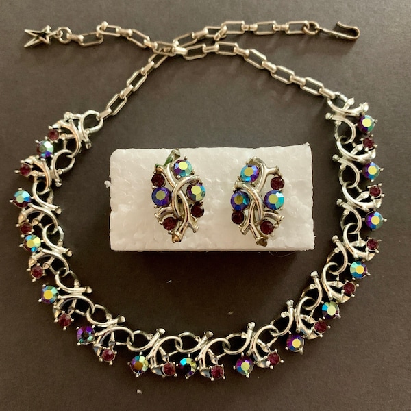 Vintage Star Jewelry necklace and earrings contain sparkling iridescent blue aurora borealis rhinestones in a silver toned setting.