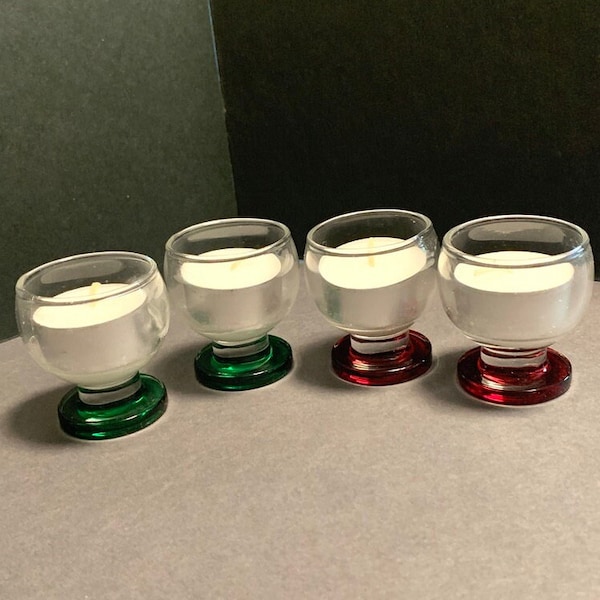 Cute holiday small table lights with candles. Two green bottoms and two red bottoms. Set of 4. Each light is 2" x 1.5".