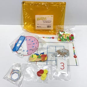 May include: A yellow zippered pouch containing math manipulatives and workmats. The kit includes a clock, number cards, geometric shapes, coins, and colored counters. The text on the pouch reads "MATH My Manipulatives and Workmats."