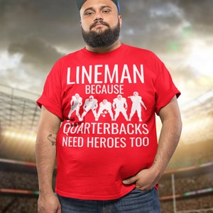 Lineman Because Quartbacks Need Heroes Too, Football Shirt Unisex Heavy Cotton Tee