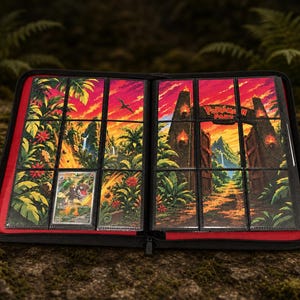 May include: A black zippered trading card binder with a red interior lining. The pages feature a vibrant jungle-themed illustration with a stone gate and the text Pokémon Park. One individual trading card is inserted into a clear plastic pocket.