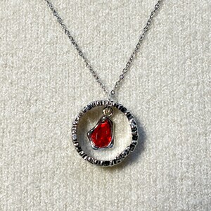 Necklace from the Throne of Glass series representing Manon Blackbeak and Dorian Havilliard, hence Hello Princeling