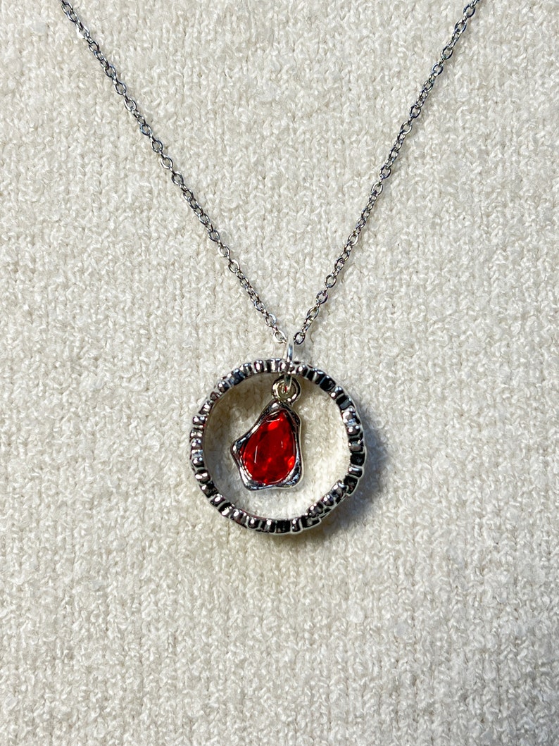 Necklace from the Throne of Glass series representing Manon Blackbeak and Dorian Havilliard, hence Hello Princeling