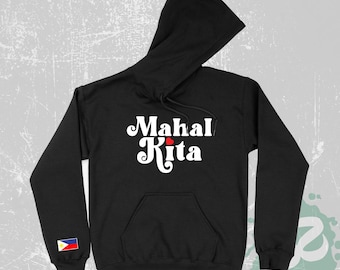 May include: A black hooded sweatshirt featuring the white text Mahal Kita with a small red heart between the words. A small rectangular patch displaying the flag of the Philippines is positioned on the lower portion of the right sleeve.