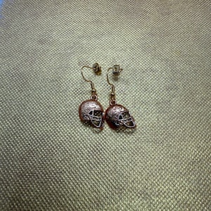 Pendientes de casco de oro de 24 k ND