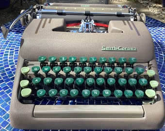 Vintage Smith Corona Silent manual portable typewriter with original case