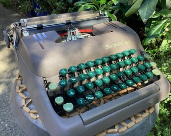 Vintage Smith Corona Silent manual portable typewriter with original case and brush