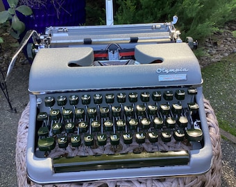 Máquina de escribir manual portátil Olympia SM3 vintage con estuche original y copia del manual de usuario
