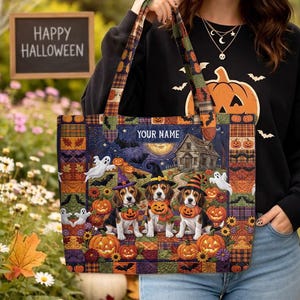 May include: A rectangular tote bag featuring a Halloween-themed patchwork design with three beagle dogs wearing witch hats and holding pumpkins. The scene includes ghosts, a house, and a moon, with the text YOUR NAME printed at the top center.