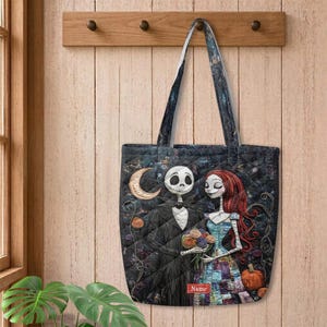 May include: A quilted tote bag featuring a dark, starry background with a printed illustration of a skeletal figure in a pinstripe suit and a female figure with long red hair in a patchwork dress, holding a bouquet of flowers near a pumpkin.