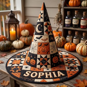 May include: A conical witch hat featuring a patchwork design in orange, black, and cream. The fabric displays patterns of pumpkins, bats, spiders, webs, stars, and moons. The name SOPHIA is embroidered in large cream letters on the wide brim.
