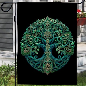 May include: A black garden flag featuring a detailed, symmetrical design of a tree with intertwined branches and roots. The tree is rendered in shades of green and teal, with intricate Celtic knotwork patterns.