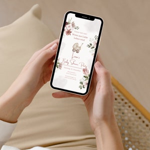 May include: A pink and white floral baby shower invitation on a smartphone screen. The invitation reads "Feiere mit uns! Wenn aus Liebe Leben wird" and "Lina's Baby Shower Party" with the date "Samstag, 10. Dezember".