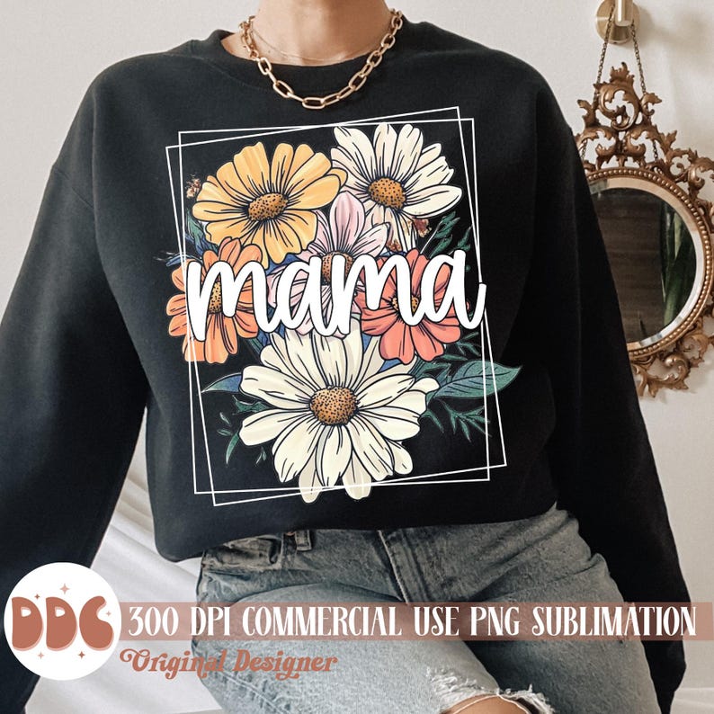 May include: Black sweatshirt featuring a floral design and the word "mama" in white lettering.