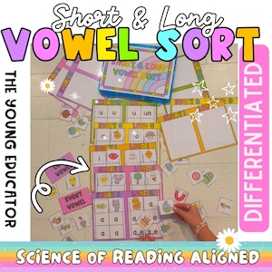 May include: A colorful educational game for sorting short and long vowel sounds. The game includes cards with pictures and words, as well as a sorting mat with sections for short and long vowels. The game is labeled "Short & Long Vowel Sort" and "The Young Educator".