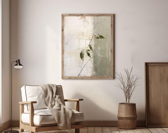 May include: An abstract painting in a wooden frame features a branch with green leaves against a backdrop of beige and green hues. A wooden armchair with a white cushion and a beige throw blanket sits in front of the painting. A black floor lamp and a decorative pot are also visible.