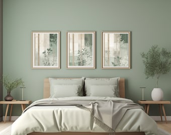 May include: A green bedroom with a bed, two nightstands, and three framed prints with a nature theme. The bed has a white duvet and a gray throw blanket. The nightstands are made of wood and have lamps on them.
