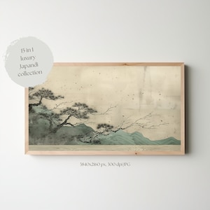May include: A framed print of a Japanese-inspired landscape painting with a light brown frame. The painting features a mountain range with a pine tree in the foreground. The background is a light beige color with a subtle texture.
