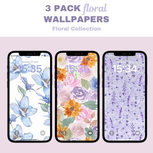 Op de afbeelding: Drie telefoonachtergronden met bloemenmotieven. De eerste achtergrond heeft een witte achtergrond met blauwe bloemen. De tweede achtergrond heeft een roze en witte achtergrond met oranje, roze en paarse bloemen. De derde achtergrond heeft een paarse achtergrond met kleine paarse bloemen.