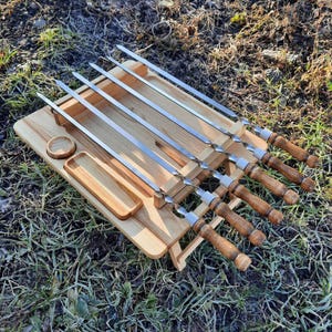 Folding Wooden BBQ Skewer Grill Stand – Portable Outdoor Barbecue Table with 6 Stainless Steel Kebab Sticks, Shashlik Roaster