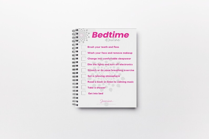 May include: A white spiral bound notebook with a pink and gray design. The cover has the text "Bedtime Routine" and a checklist of activities to do before bed, including brushing teeth, washing face, changing into pajamas, dimming lights, stretching, setting a relaxing atmosphere, reading, taking a shower, and getting into bed.