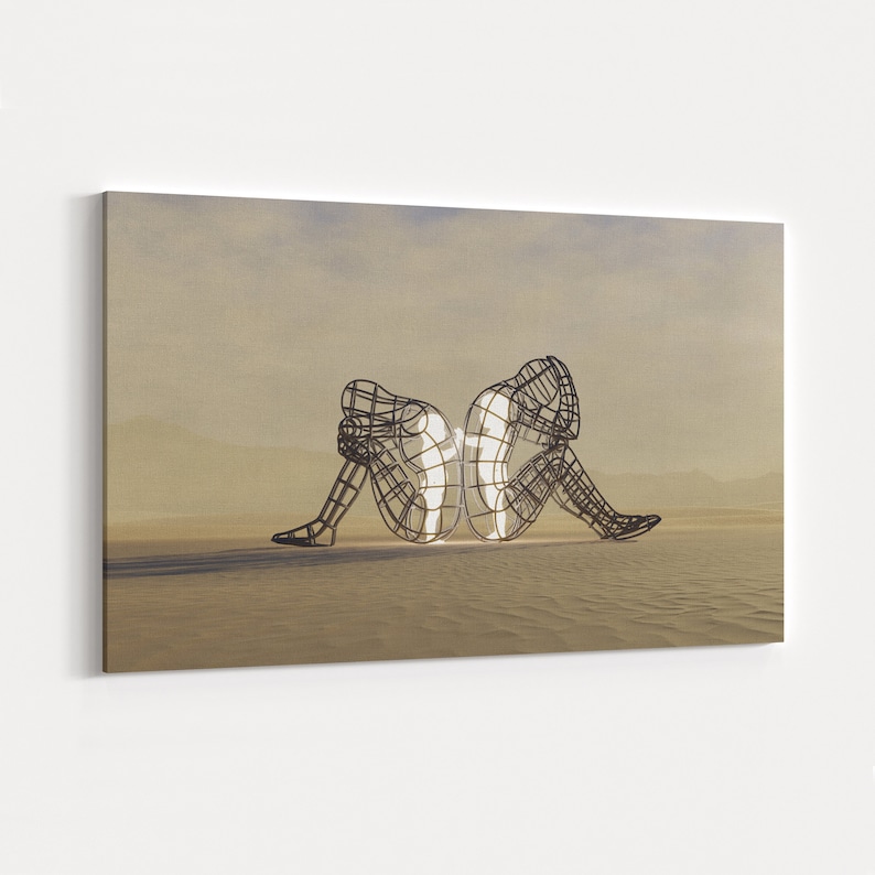 May include: Two wire frame sculptures of people sitting back to back, facing opposite directions. The sculptures are in a desert landscape with a light brown background. The sculptures are made of metal and are illuminated from within, creating a glowing effect.