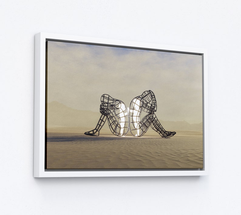 May include: Two wire frame sculptures of people sitting back to back, facing opposite directions. The sculptures are illuminated from within, casting a soft glow. The sculptures are set against a light brown background.