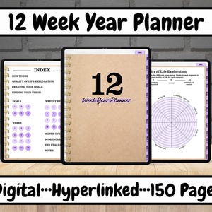 May include: A digital planner with a brown cover and the text "12 Week Year Planner" on the front. The planner is open to a page with the text "12 Week Year Planner" and a purple and white wheel chart. The planner is on a wooden table.