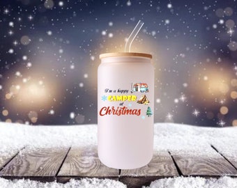 May include: A frosted glass tumbler with a bamboo lid and a clear straw. The tumbler features the text "I'm a happy CAMPER at Christmas" with camping-themed graphics. The background shows a snowy scene.