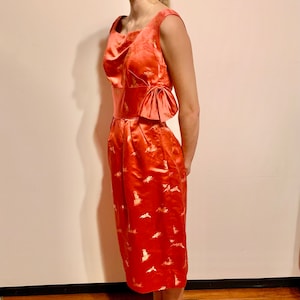 Vintage 1950s Hand Tailored Orange Satin Dress with Gold Japanese Iconography is in excellent condition.