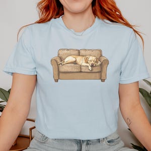 Comfort Colors t-shirt with yellow Labrador retriever sleeping on couch graphic design.