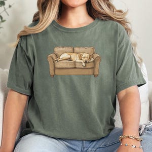 Comfort Colors t-shirt with yellow Labrador retriever sleeping on couch graphic design.