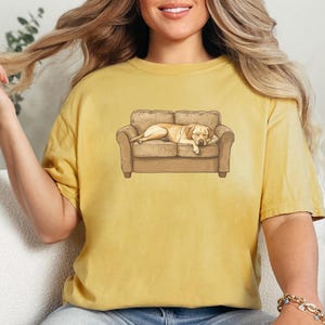 Comfort Colors t-shirt with yellow Labrador retriever sleeping on couch graphic design.