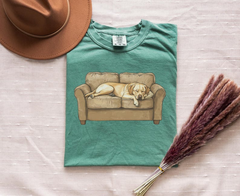 Comfort Colors t-shirt with yellow Labrador retriever sleeping on couch graphic design.