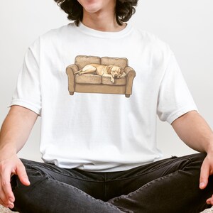 Comfort Colors t-shirt with yellow Labrador retriever sleeping on couch graphic design.