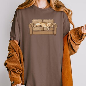 Comfort Colors t-shirt with yellow Labrador retriever sleeping on couch graphic design.