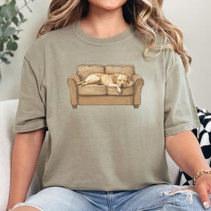 Comfort Colors t-shirt with yellow Labrador retriever sleeping on couch graphic design.