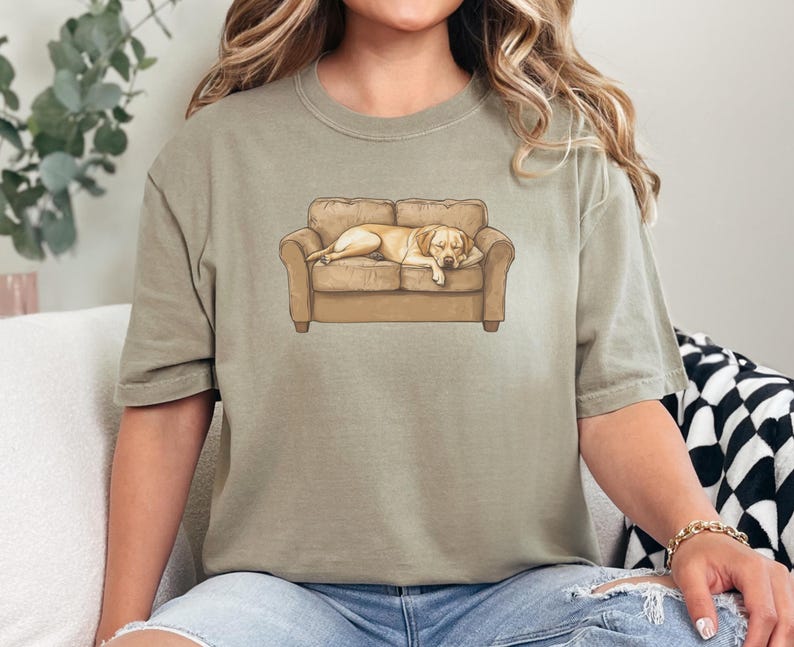 Comfort Colors t-shirt with yellow Labrador retriever sleeping on couch graphic design.