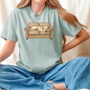 Comfort Colors t-shirt with yellow Labrador retriever sleeping on couch graphic design.