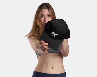 May include: A black baseball cap with a white camel embroidered on the front.