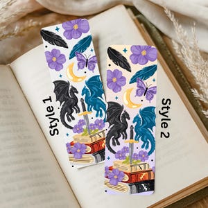 May include: Two rectangular bookmarks labeled Style 1 and Style 2, featuring illustrations of purple flowers, black and blue feathers, a yellow crescent moon, a purple butterfly, a black dragon, a blue dragon, a silver sword, and a stack of books.