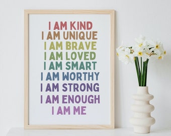 May include: A framed print with a white background and rainbow coloured text that reads "I am kind, I am unique, I am brave, I am loved, I am smart, I am worthy, I am strong, I am enough, I am me".