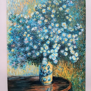May include: A painting of a bouquet of white flowers with blue centers in a blue and white vase on a wooden table. The background is a yellow and green abstract pattern.
