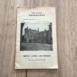 May include: A vintage souvenir programme for Ripley Castle and Church, Yorkshire. The black and white image shows the castle's facade. The text reads "SOUVENIR PROGRAMME" and "RIPLEY CASTLE AND CHURCH" with the date "3rd, 4th and 5th JULY, 1959".
