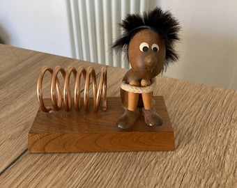 Vintage Japanese MCM wooden figure stylised sitting with legs pulled up by his side coiled metal ring desk top letter rack