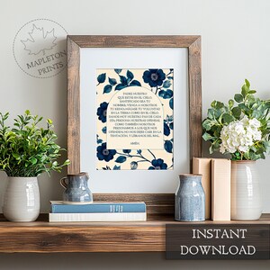May include: A printable art print featuring a blue and white floral design with the Lord's Prayer in Spanish text. The text reads "Padre Nuestro que estas en el cielo, santificado sea tu nombre..." The print is framed in a brown wood frame and is ready for instant download.