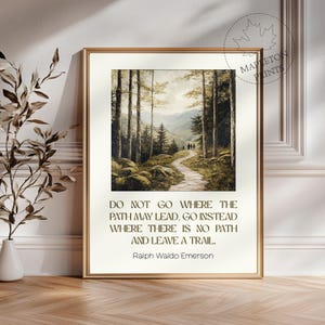 May include: A framed print with a quote by Ralph Waldo Emerson: "Do not go where the path may lead, go instead where there is no path and leave a trail." The print features a painting of a forest path leading through a lush green forest.