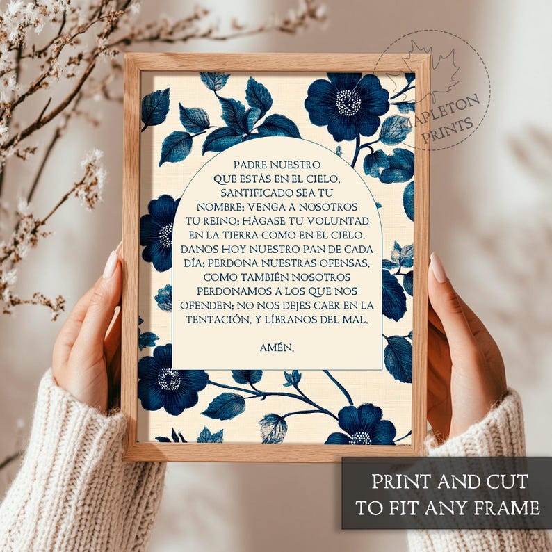 May include: A printable art print with a cream background and blue floral design. The print features the Lord's Prayer in Spanish, "Padre Nuestro", with a decorative arch above the text.